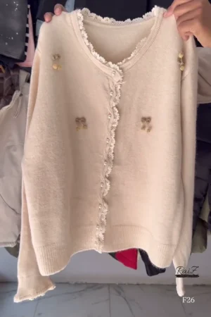 Knit Cardigan for Women Featuring Delicate Lace Trim on V-Neck and Placket, Pearl Buttons, and Gold Bow Embellishments, Available in Soft Beige and Light Sky Blue